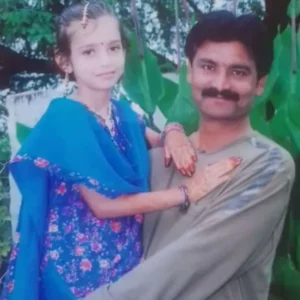 Childhood photo of Chahat Pandey with her father
